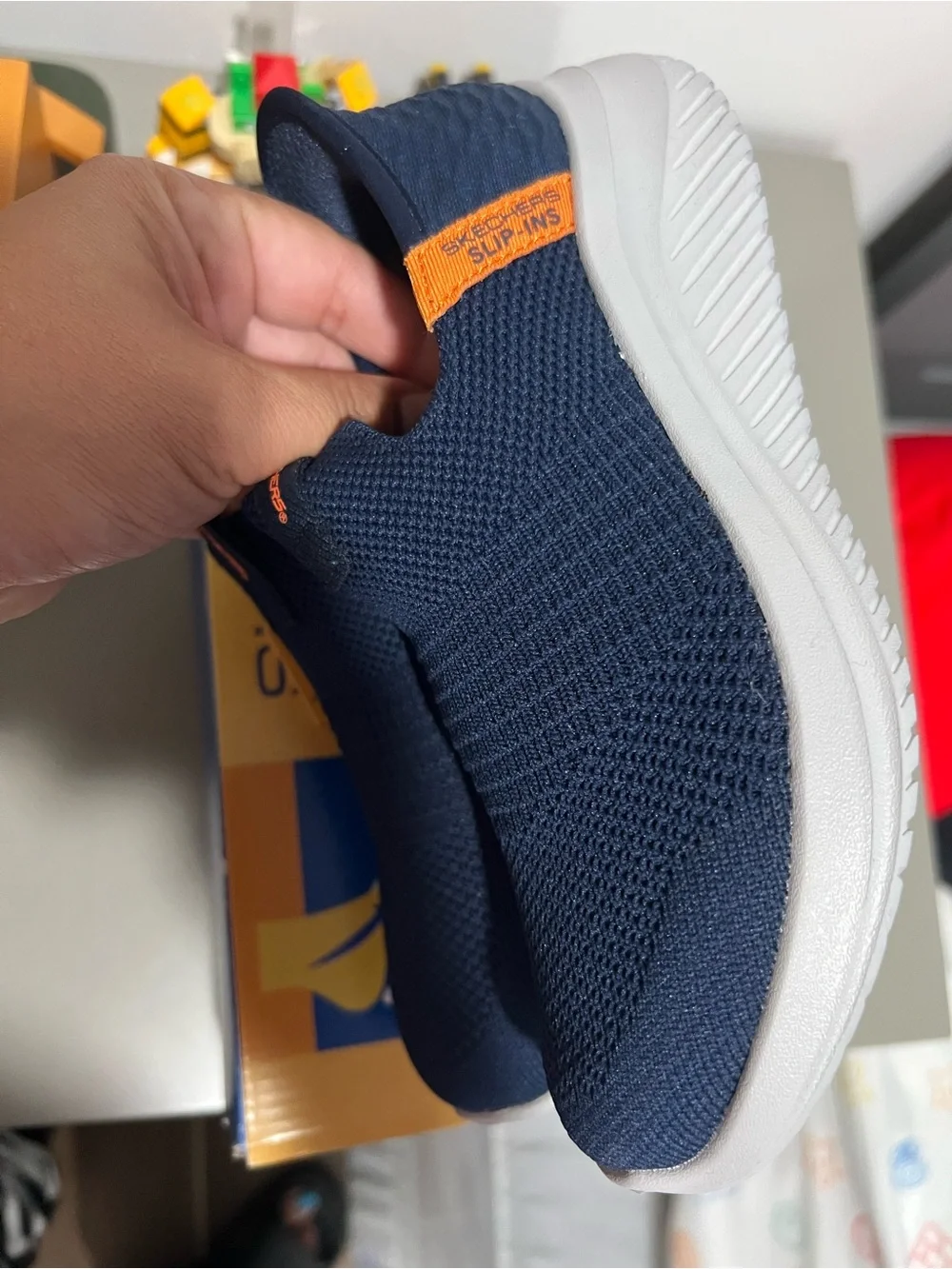Skechers Kids Navy Slip-On Sneakers with Orange Pull Tab